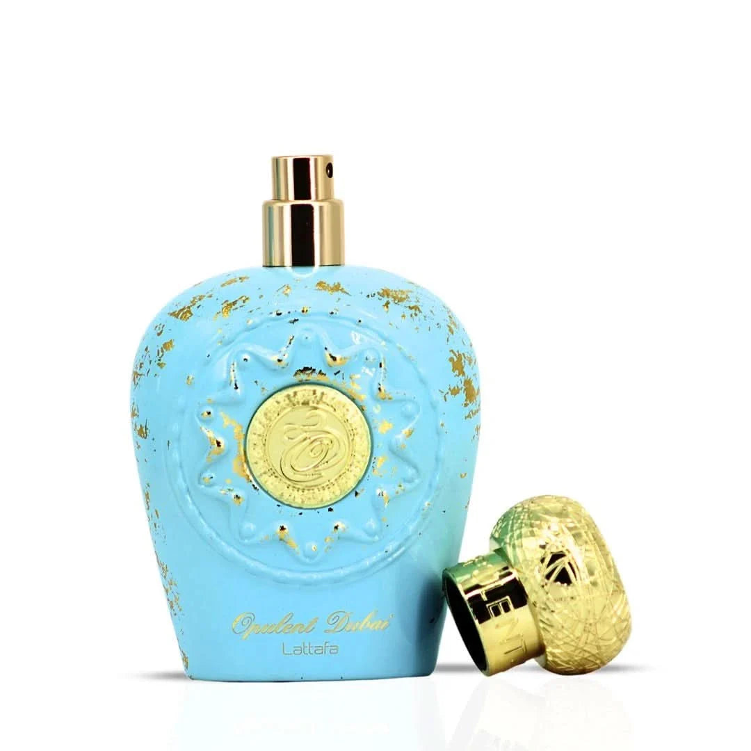 Opulent Dubai Eau de Parfum Spray 100ml by Lattafa, elegant glass bottle with intricate gold detailing and a luxurious fragrance.