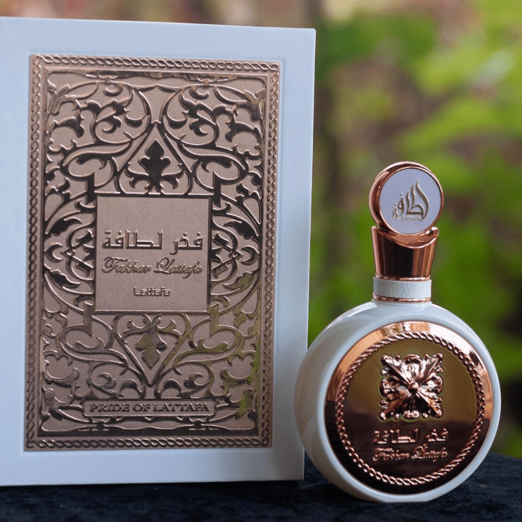 Fakhar for Women Eau de Parfum spray by Lattafa, 100ml bottle with elegant floral design and a sleek perfume cap.