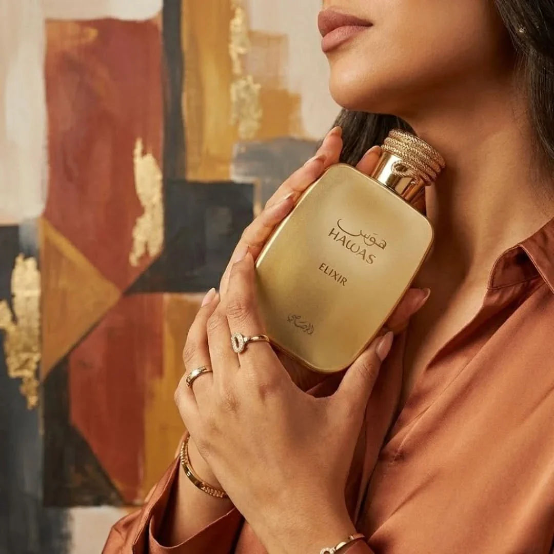 Rasasi Hawas Elixir Eau de Parfum spray 100ml bottle, elegant design with a dark blue and gold accents.