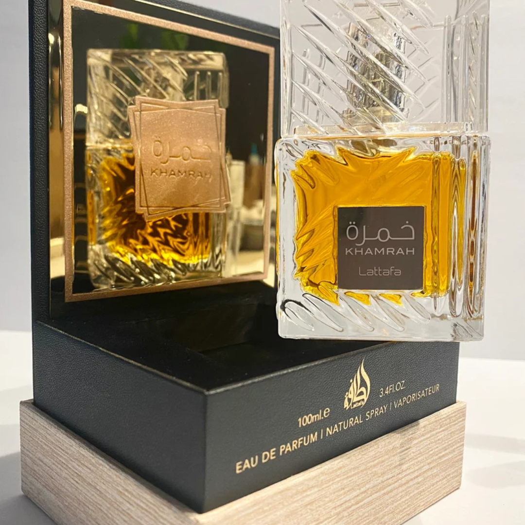 Lattafa Khamrah Eau de Parfum spray 100ml with elegant bottle, showcasing a luxurious fragrance presentation.