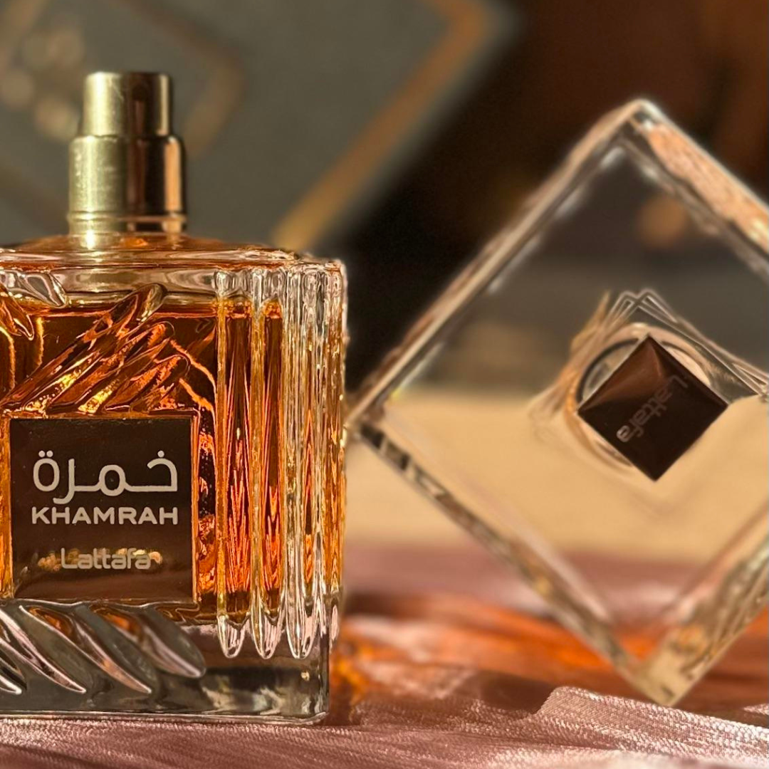 Lattafa Khamrah Eau de Parfum spray 100ml, elegant fragrance bottle with a sleek design and gold accents.